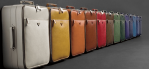 different colours of luggage aligned