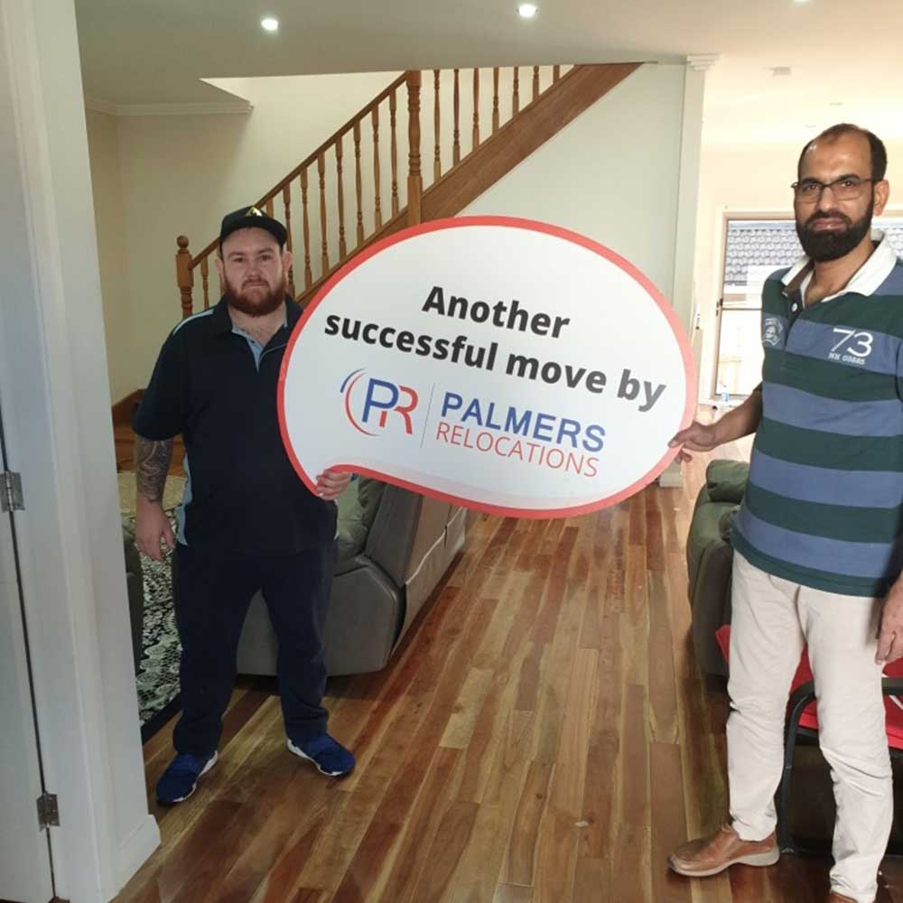 Happy Customer Holding a Palmers Sign