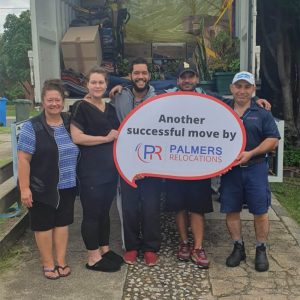 Happy Customer Holding a Palmers Sign