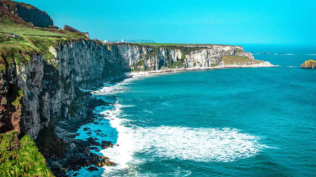 coast in ireland with blue ocean and waves